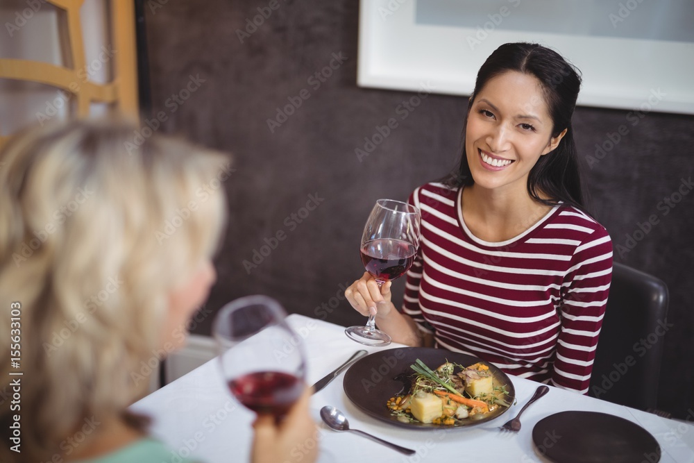 Portrait of woman having a glass of red wine