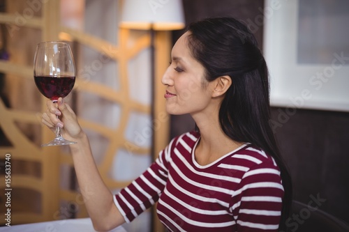 Woman having a glass of red wine