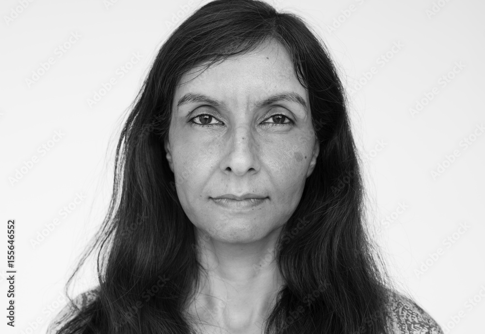 Senior indian woman looking at camera on white background Senior indian woman looking at camera on white background