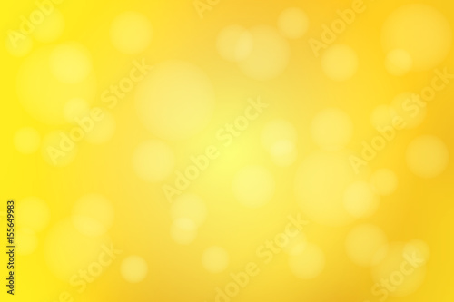 Bright golden yellow abstract with bokeh lights blurred background