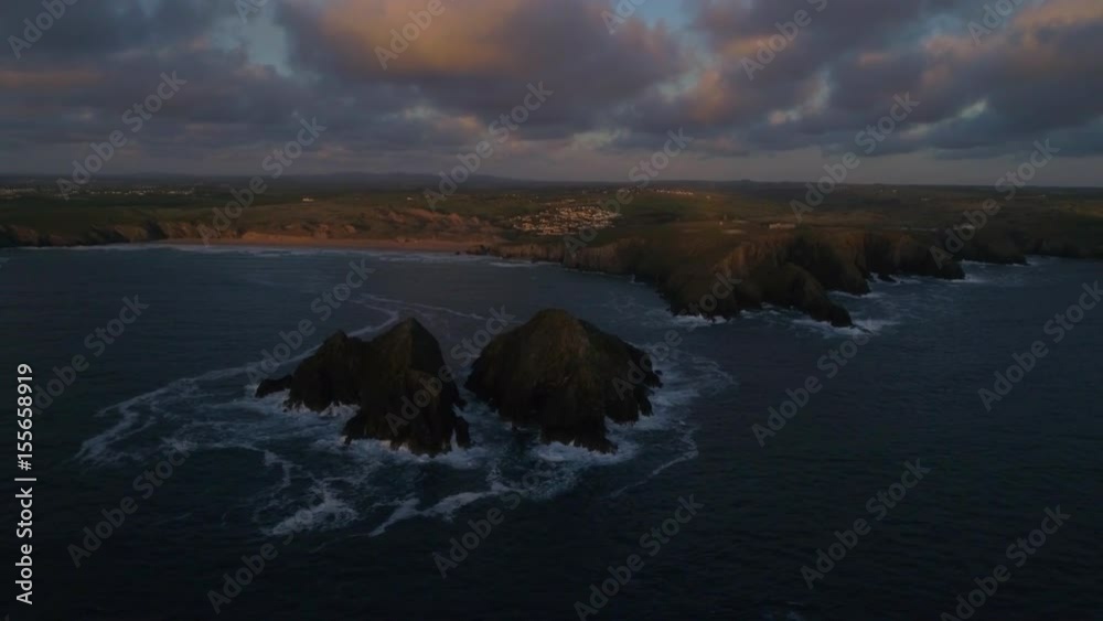 Aerial view of the coast with sea waves breaking against rocky cliffs, Devon and Cornwall Aerial view of the coast with sea waves breaking against rocky cliffs, Devon and Cornwall