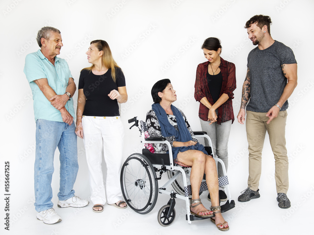 Group of people smiling with lady on wheelchair Group of people smiling with lady on wheelchair