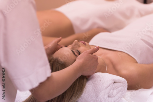 woman receiving a head massage