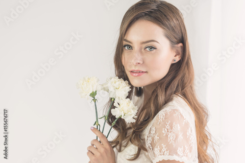 Sweet girl with a bouquet of flowers