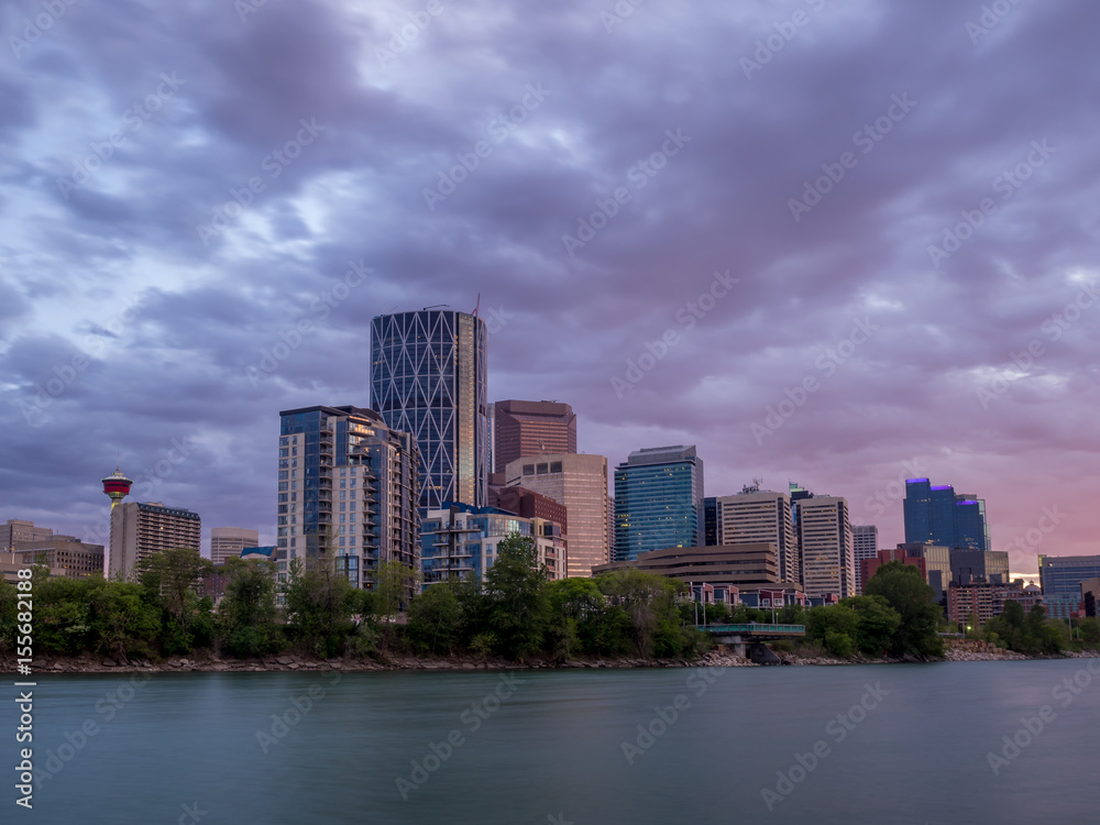 Calgary skyline along the Bow river at sunset. Calgary skyline along the Bow river at sunset.