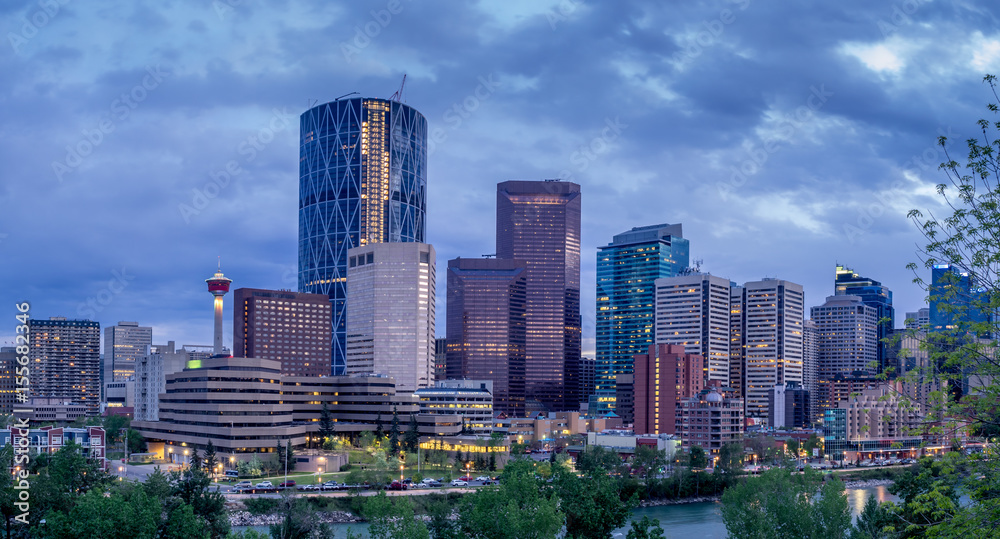 Fototapeta premium Skyscrapers sparkle as the sun sets in Calgary Alberta.