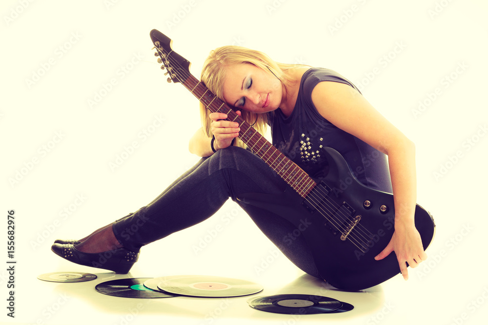 Woman with electrical guitar and vinyl record. Woman with electrical guitar and vinyl record.