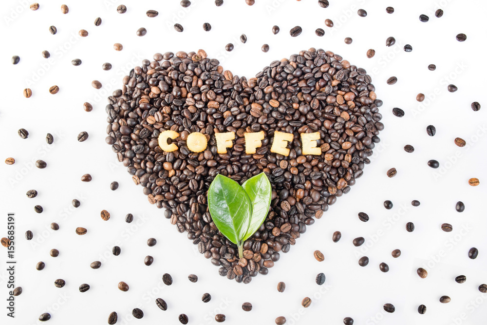 coffee beans in heart shape with cracker and leaves  on isolated on white