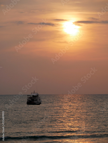 Boat with sunset on the sea at Lanta island