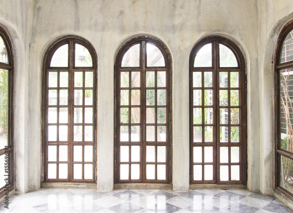 Three long glasses and wooden window Three long glasses and wooden window