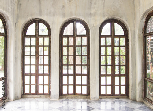 Three long glasses and wooden window