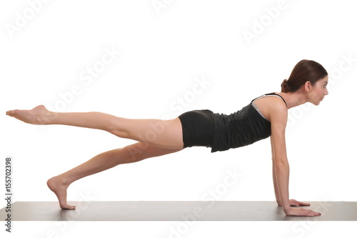 woman doing yoga exercises on yoga mat