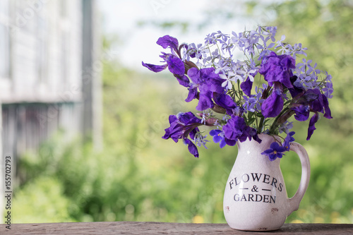 Fototapeta Naklejka Na Ścianę i Meble -  beautiful bouquet with irises on wooden table