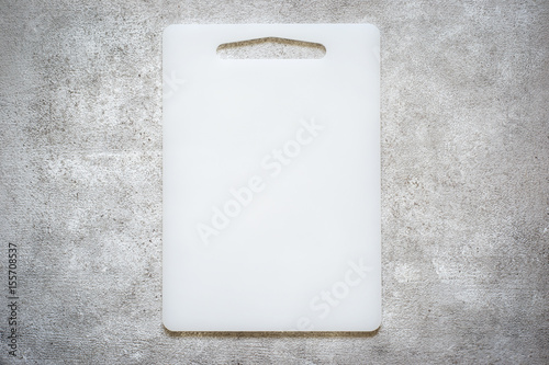Empty Cutting board on a concrete background. Top view with copy space