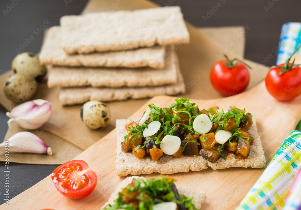 Healthy food. Appetizer. Crispbread with steamed vegetables (eggplant, carrot, onion)
