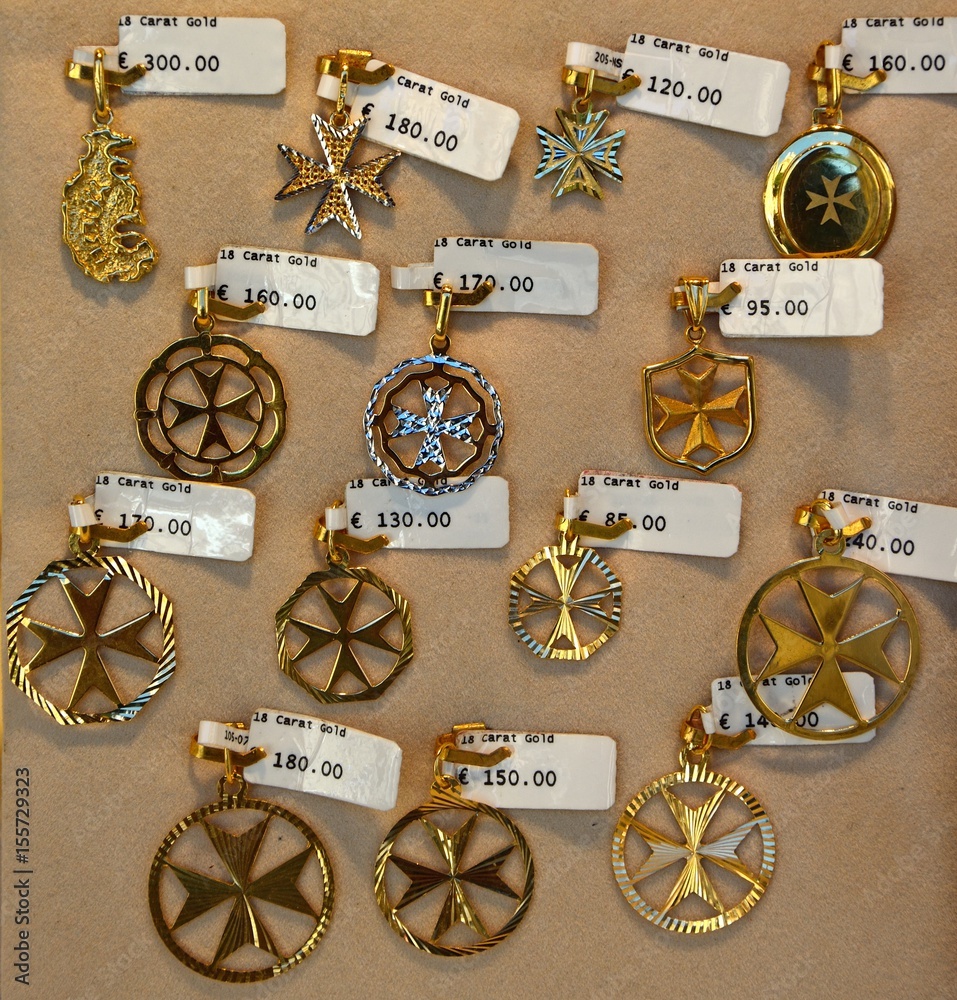 Gold Maltese cross pendants for sale Malta. Stock Photo Adobe Stock