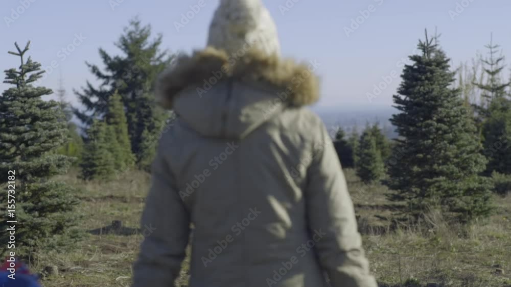 Little Boy Follows His Parents In Search Of The Perfect Christmas Tree To Cut Down Little Boy Follows His Parents In Search Of The Perfect Christmas Tree To Cut Down