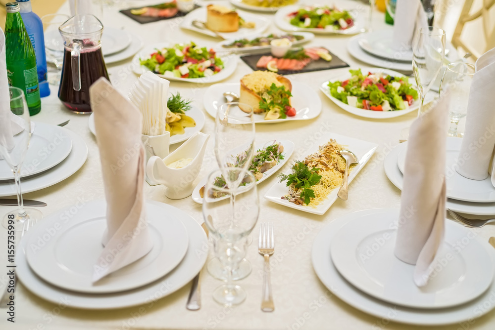 Served restaurant table with salads Served restaurant table with salads