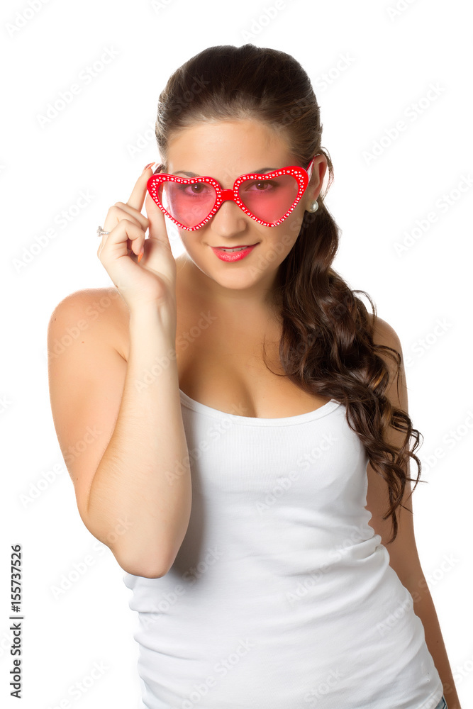 Young girl is holding red sunglasses Young girl is holding red sunglasses