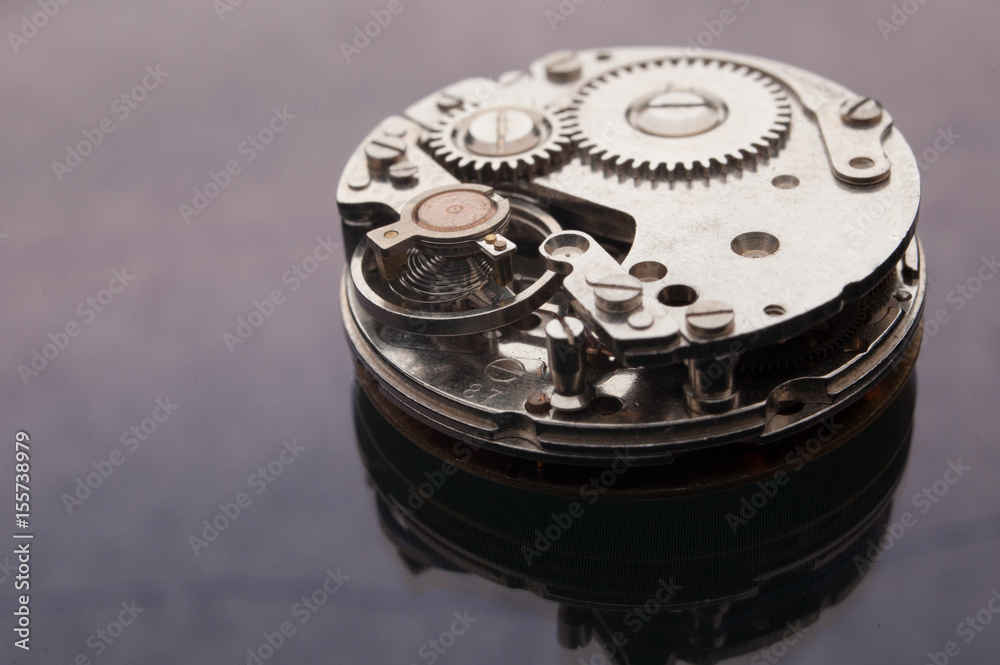 Detail of watch machinery on the table. Detail of watch machinery on the table.