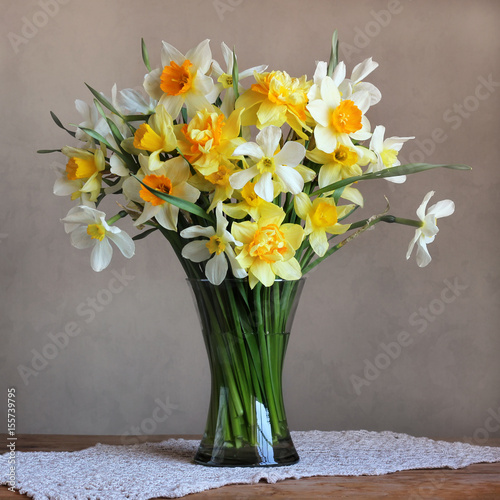Bouquet of spring flowers in a glass vase.