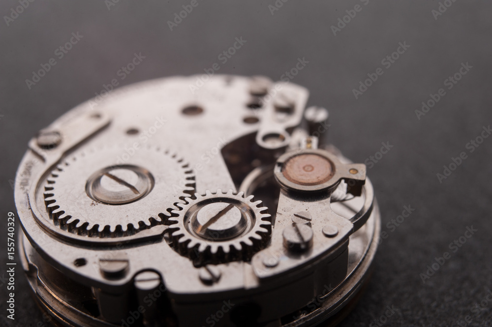 Detail of watch machinery on the table. Detail of watch machinery on the table.