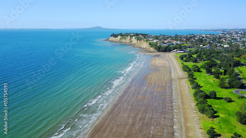 Wallpaper Mural Aerial view on sunny beach with residential suburb on the background. Auckland, New Zealand. Torontodigital.ca