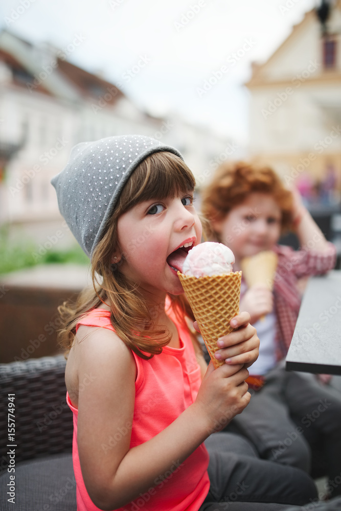 two cute hipsters eating icecream