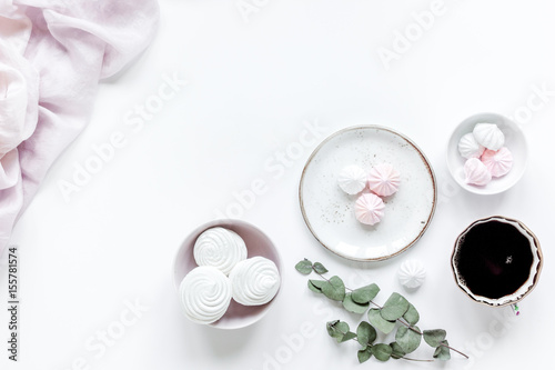 woman lunch with marsh-mallow, coffee and flowers soft light on white table background flat lay mockup