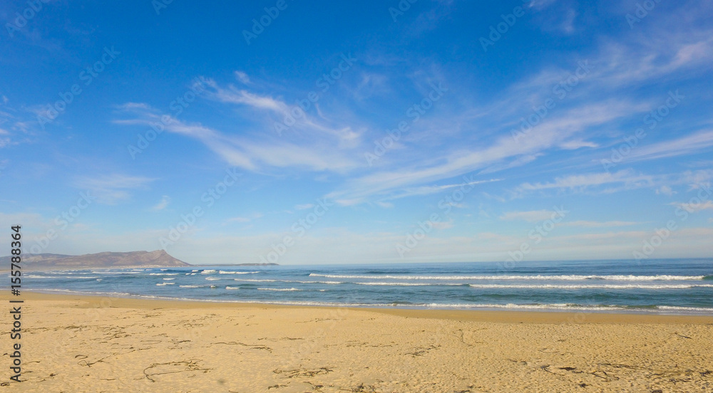 Blue Sky and Clouds over the Beach and Ocean Blue Sky and Clouds over the Beach and Ocean