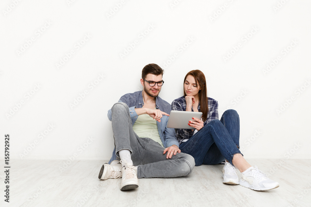 Couple ordering purchase with digital tablet Couple ordering purchase with digital tablet