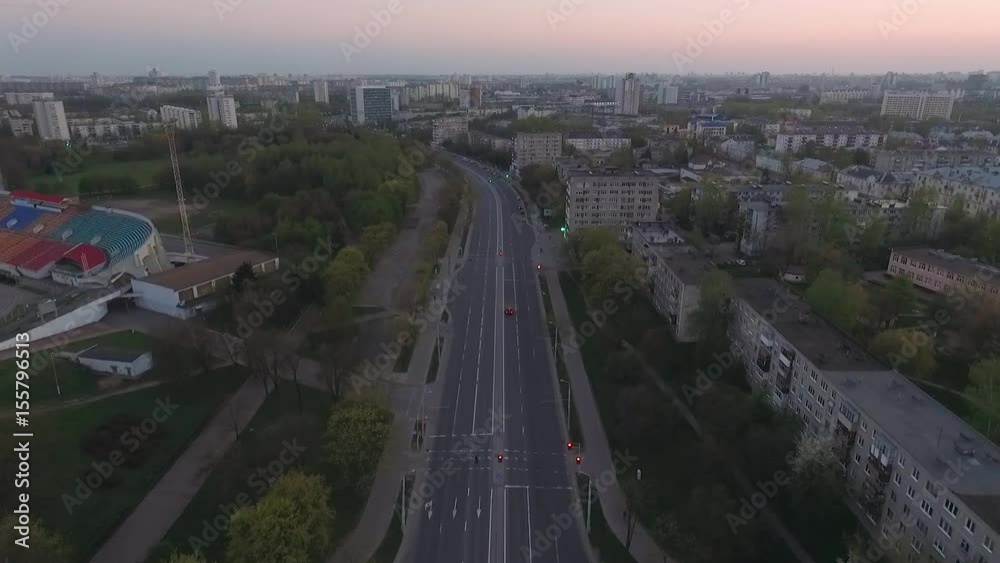 Aerial view, evening view of the city at sunset. 50 fps. View from a height.
Aerial view, evening view of the city at sunset. 50 fps. View from a height.