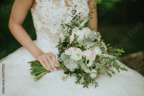 green wedding bouquet in the hand of a bride