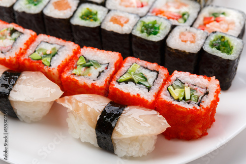 Colorful set of sushi and rolls top view, closeup