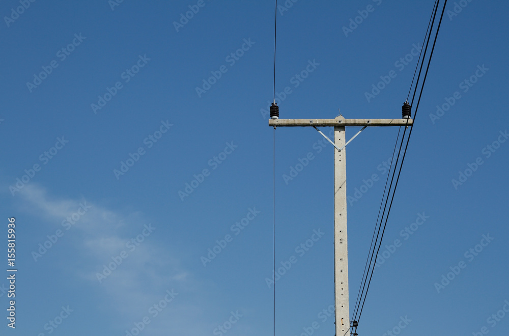an old telephone Electricity pole for energy with power lines over a clear blue sky an old telephone Electricity pole for energy with power lines over a clear blue sky