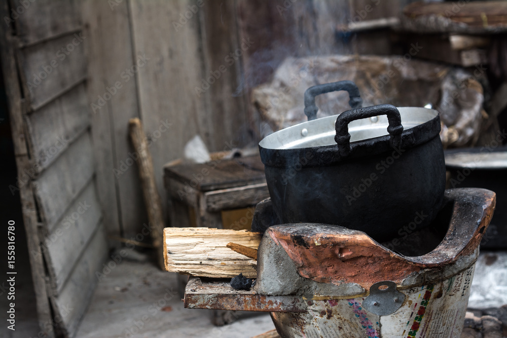Old pot cooking smut black using firewood Old pot cooking smut black using firewood
