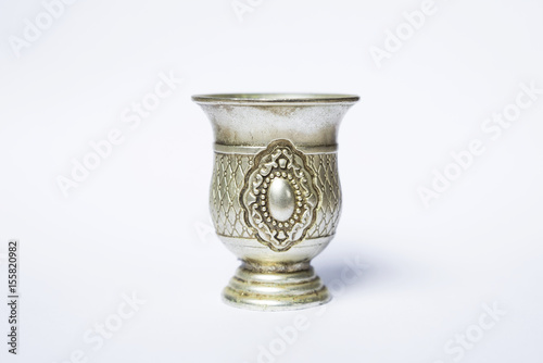 Closeup small silver cup design on white background