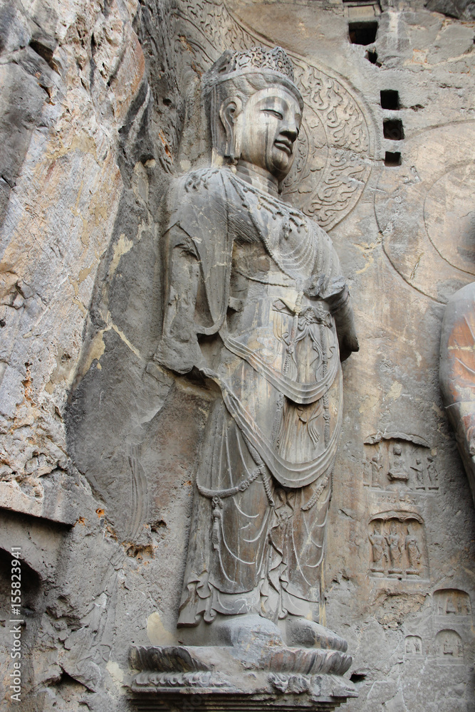 Budha's rock statue at Longmen Grottoes, Luoyang, Henan, China