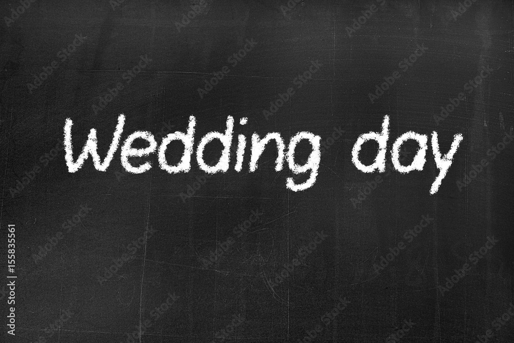 Fototapeta premium Blackboard with the text 'Wedding day'