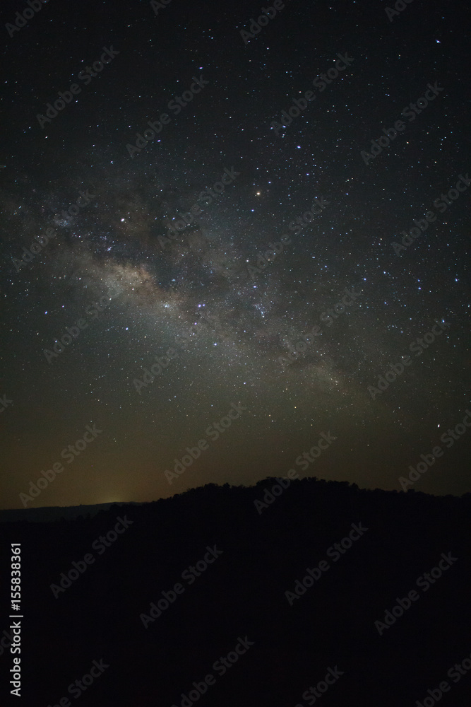 Milky Way over mountain at Phu Hin Rong Kla National Park,Phitsanulok Thailand, Long exposure photograph.with grain Milky Way over mountain at Phu Hin Rong Kla National Park,Phitsanulok Thailand, Long exposure photograph.with grain