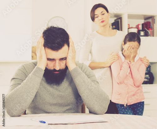 Fotografija Young family struggling to pay utility bills and rent for their apartment