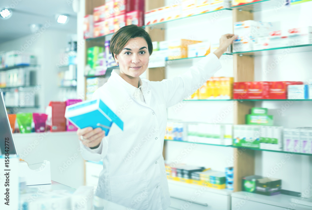 Pretty pharmacist offering reliable medicine