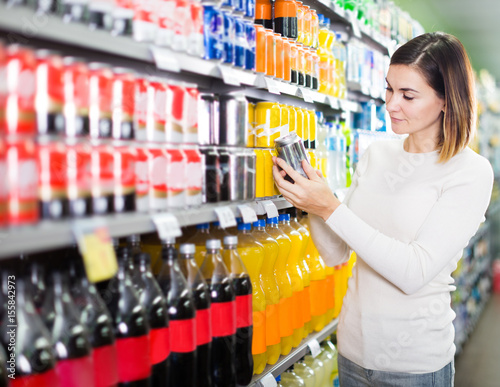 Girl customer looking for refreshing beverages photo