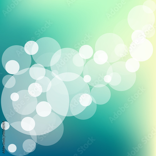 Abstract bokeh sparkles on blue blurred background
