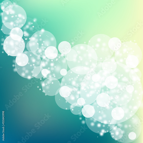 Abstract bokeh sparkles on blue blurred background
