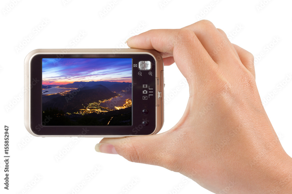 Hand with camera and Kotor Bay in Montenegro image (my photo) Hand with camera and Kotor Bay in Montenegro image (my photo)
