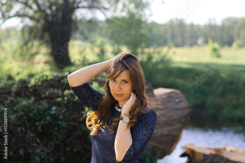 Young beautiful girl in the nature of a spring forest on a sunny. © prokop.photo