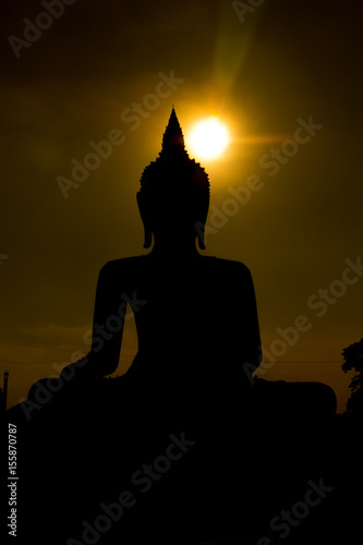 silhouette Big Buddha on sunset background in Phichit, Thailand © ptaa2010