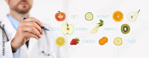 healthy food concept, Hand of nutritionist doctor pointing fruit with pen photo