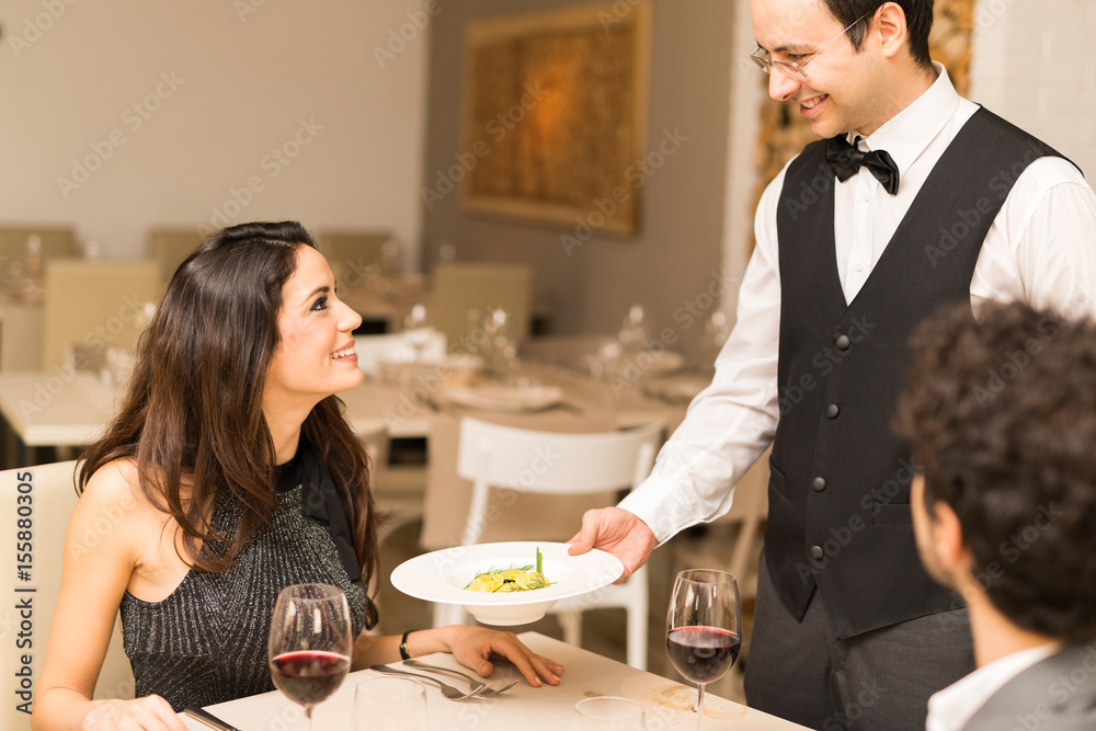 Waiter serving the dinner Waiter serving the dinner